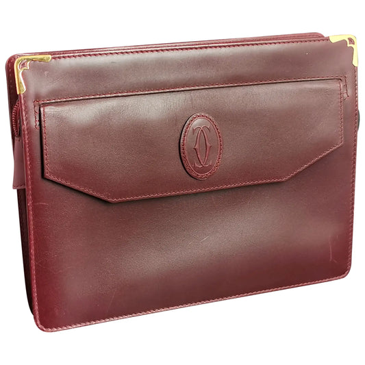 Cartier, Must De Cartier oxblood leather clutch purse, bag