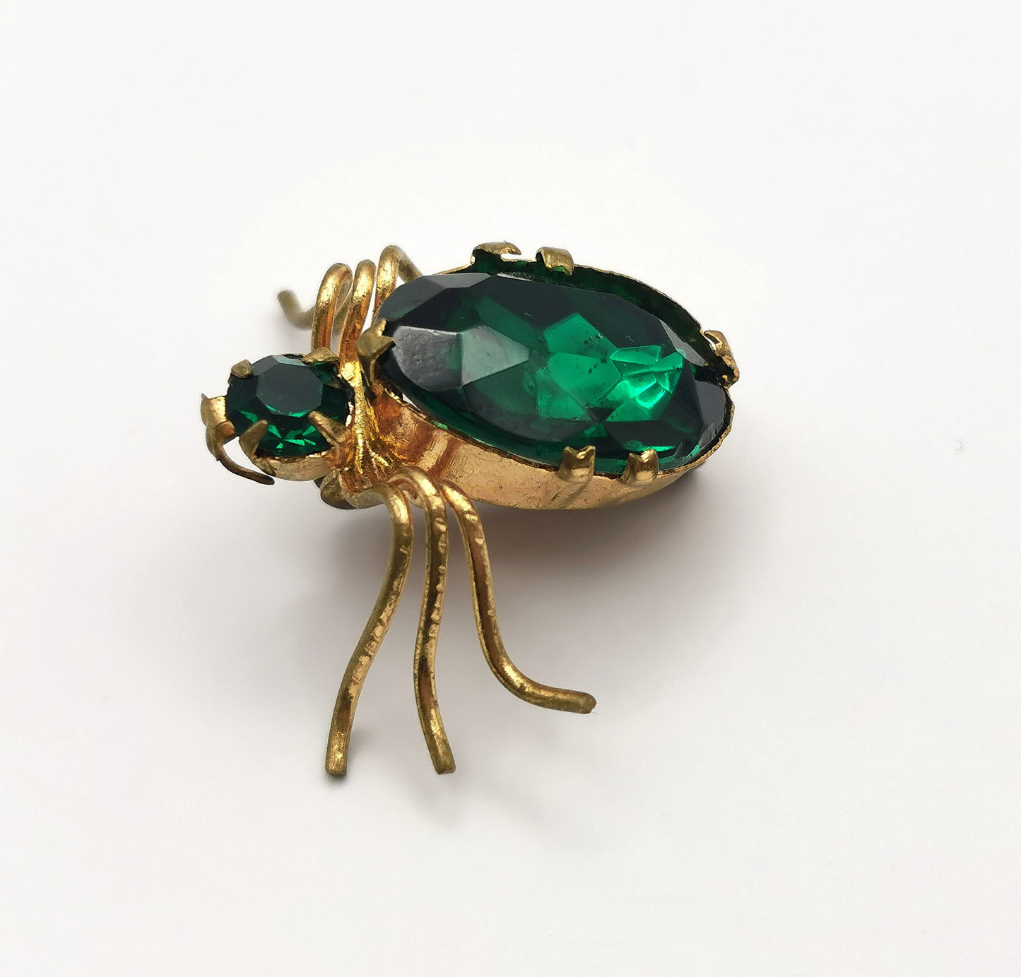 Antique gilt metal spider brooch, Emerald green paste