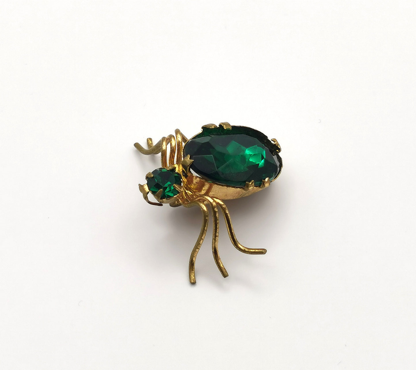 Antique gilt metal spider brooch, Emerald green paste
