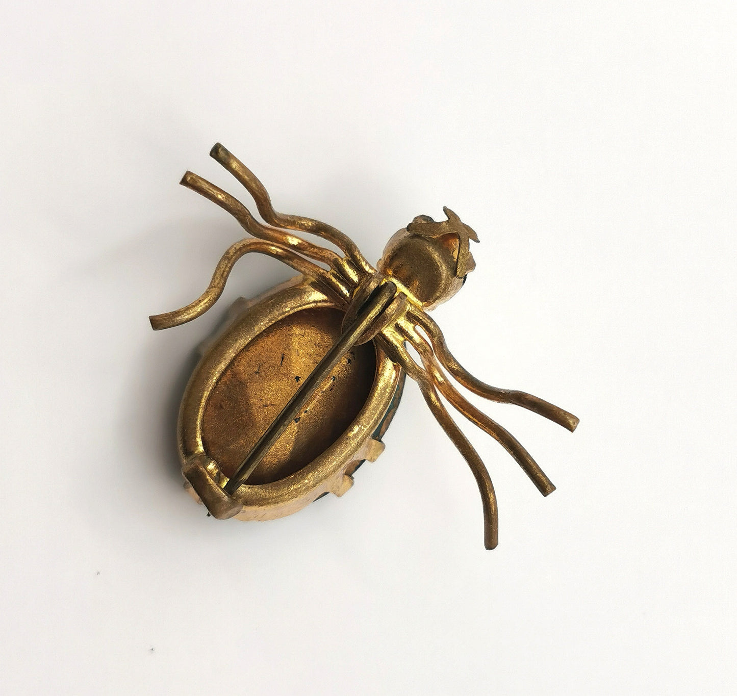 Antique gilt metal spider brooch, Emerald green paste