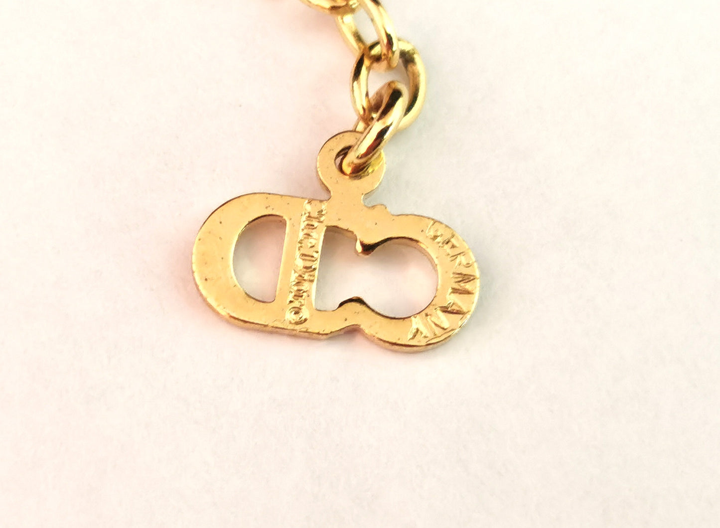 Vintage Christian Dior logo pendant necklace, gold tone and paste