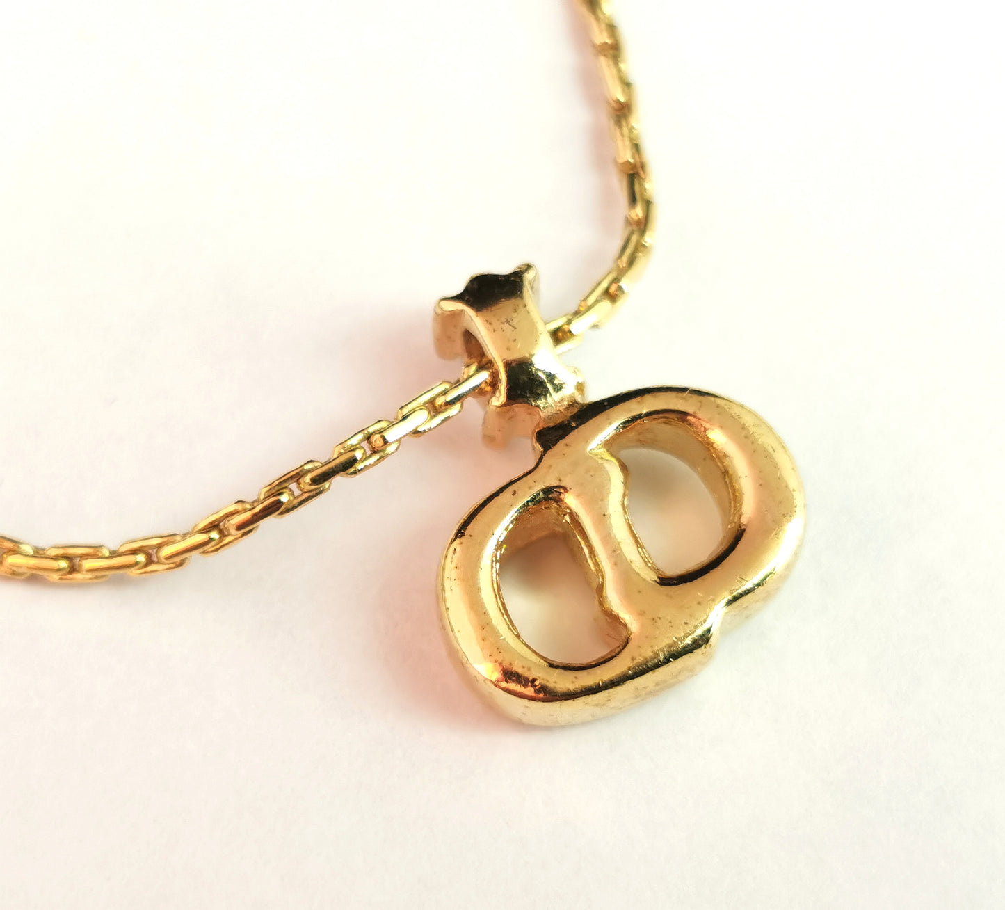 Vintage Christian Dior logo pendant necklace, gold tone and paste