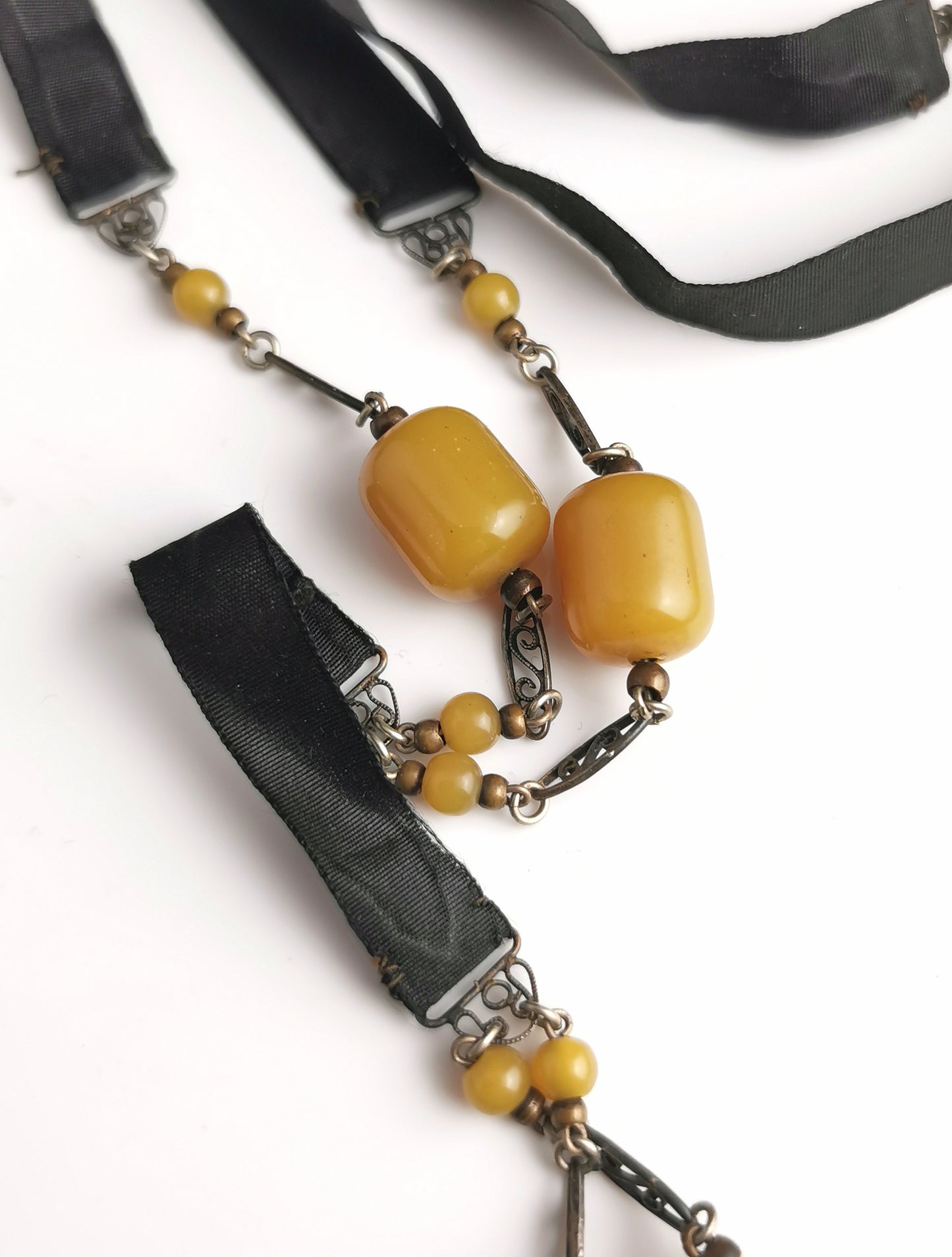 Antique Art Deco Sautoir necklace, black silk and butterscotch bead