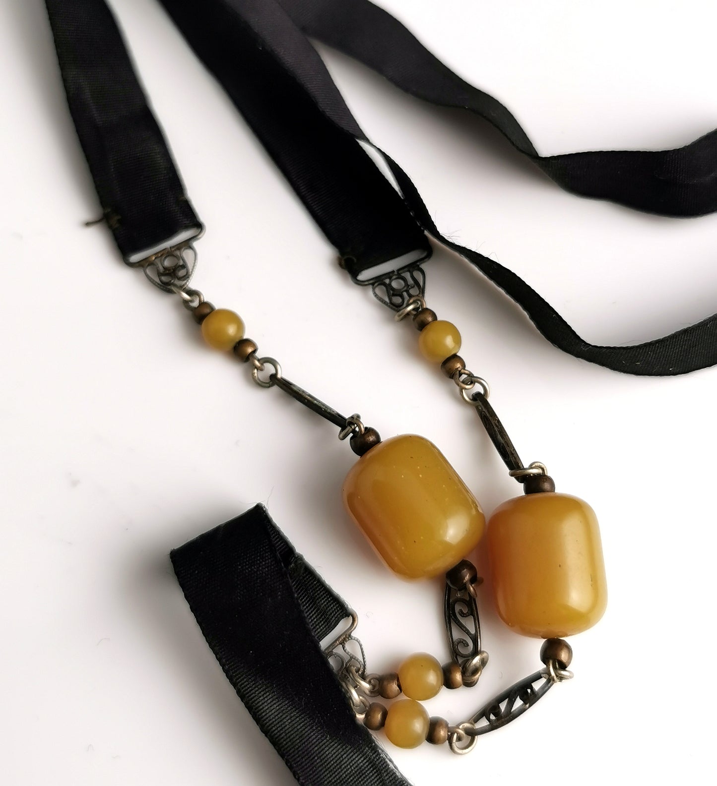Antique Art Deco Sautoir necklace, black silk and butterscotch bead