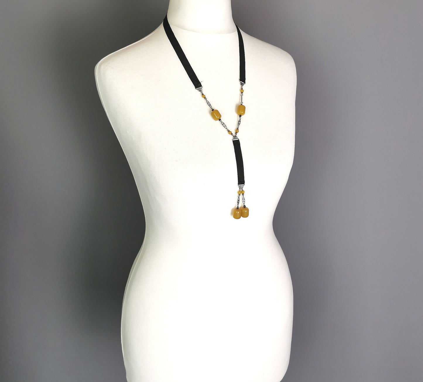 Antique Art Deco Sautoir necklace, black silk and butterscotch bead