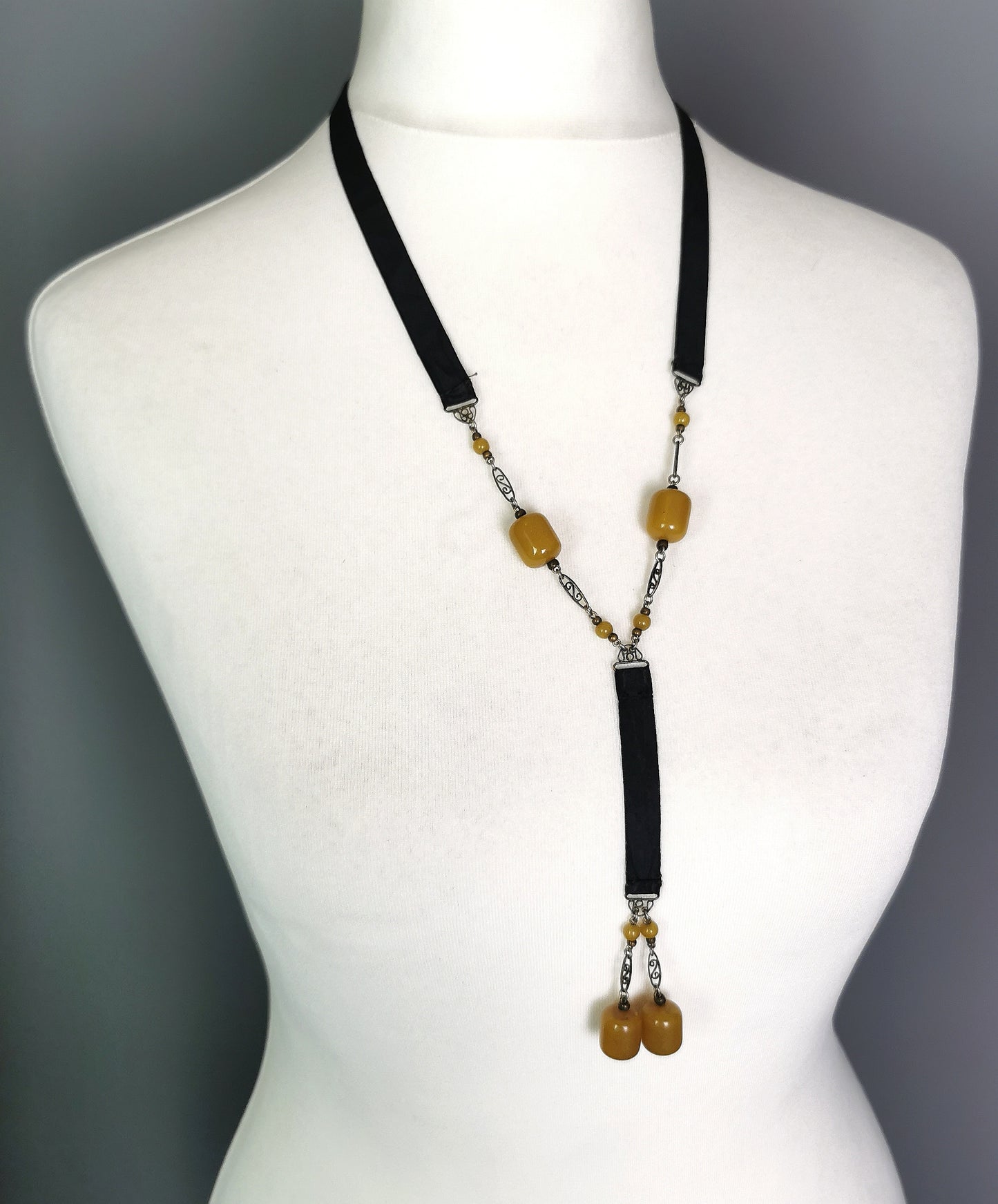 Antique Art Deco Sautoir necklace, black silk and butterscotch bead