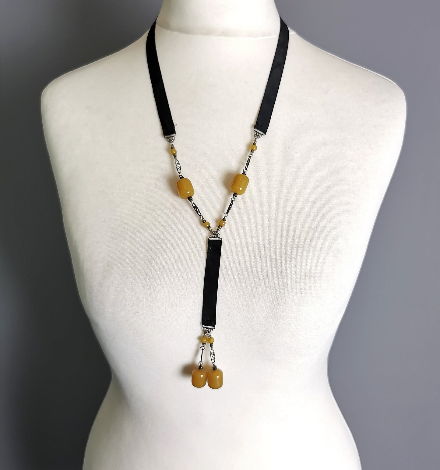 Antique Art Deco Sautoir necklace, black silk and butterscotch bead