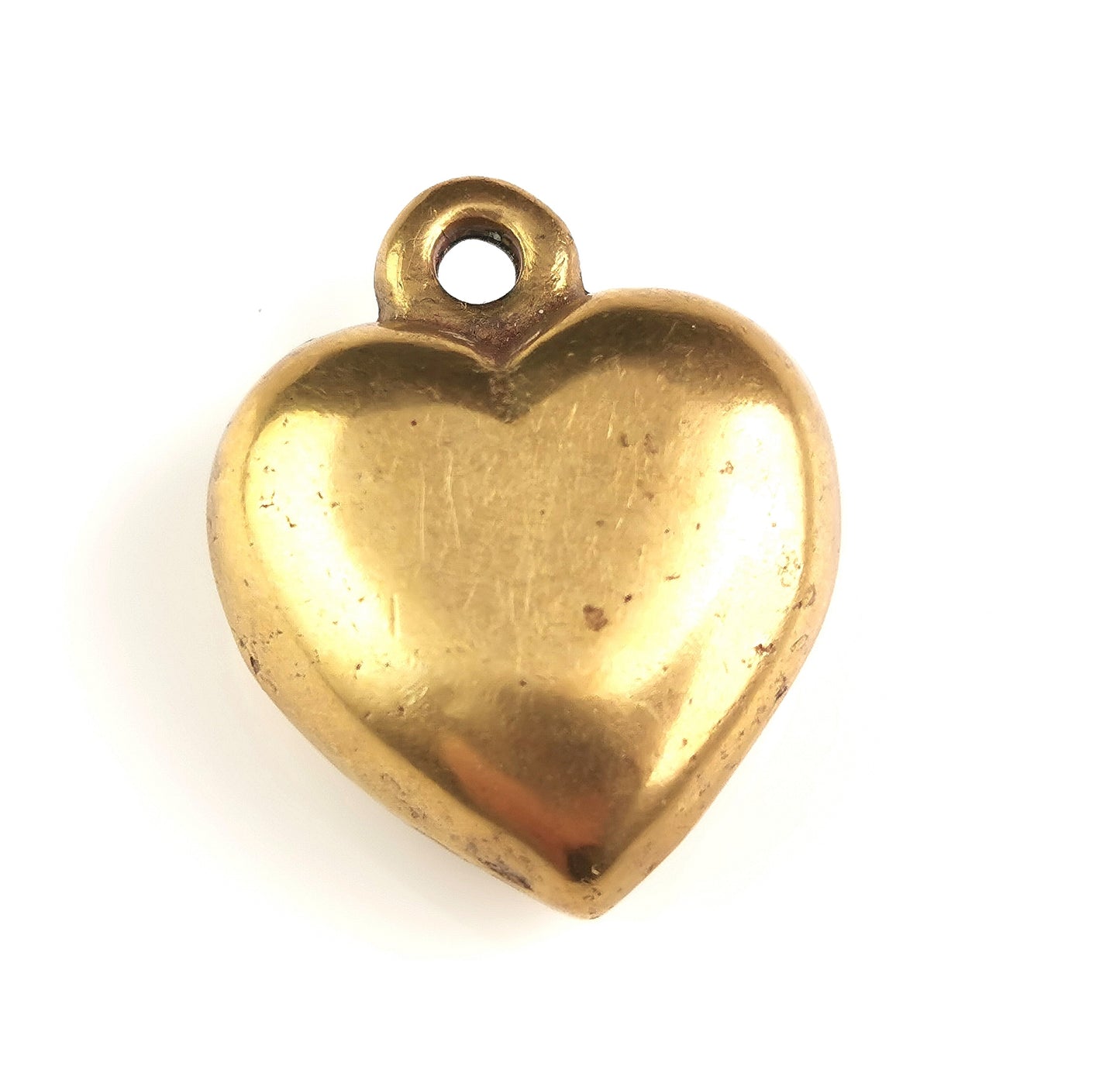 Antique Victorian brass puffy heart pendant