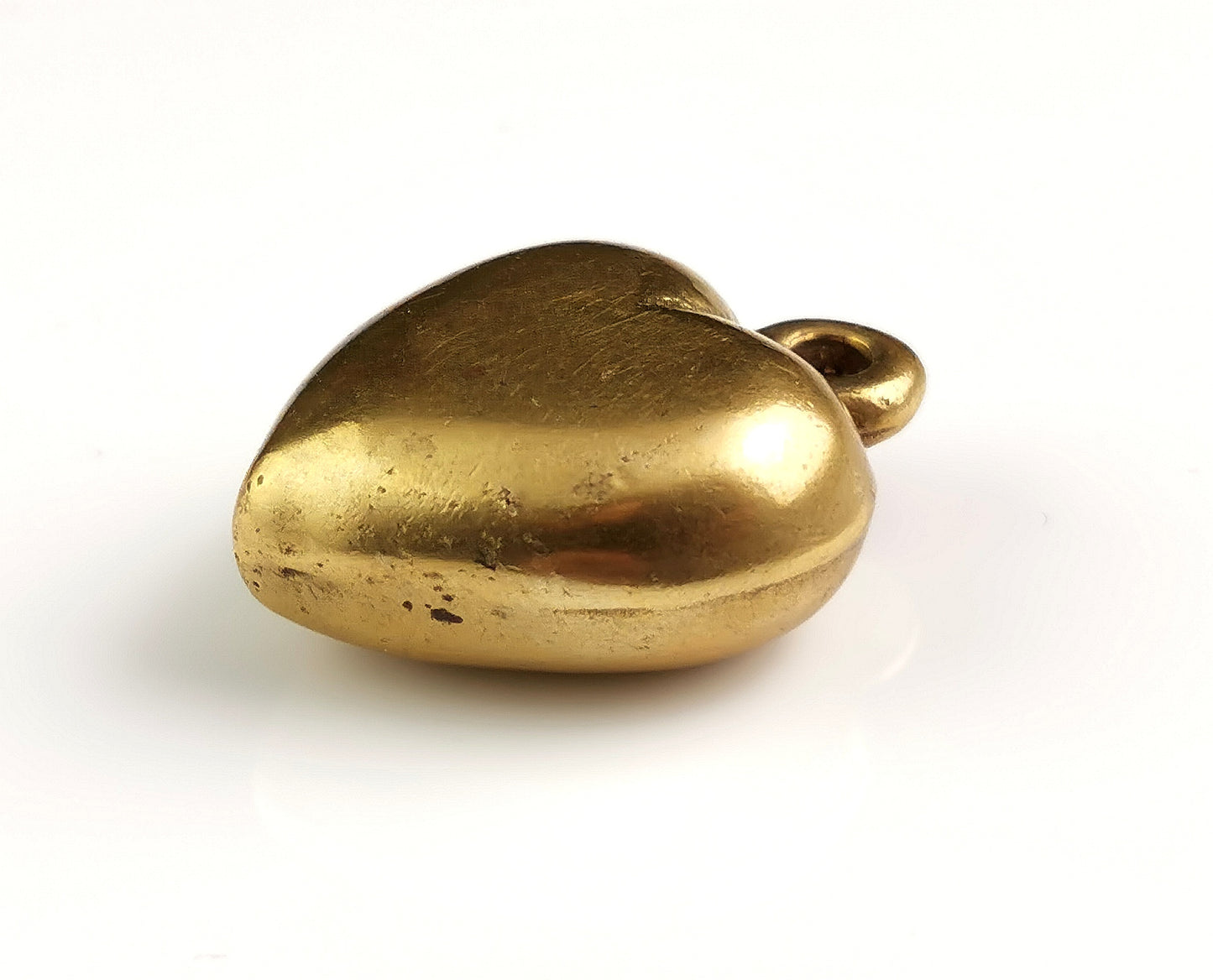 Antique Victorian brass puffy heart pendant