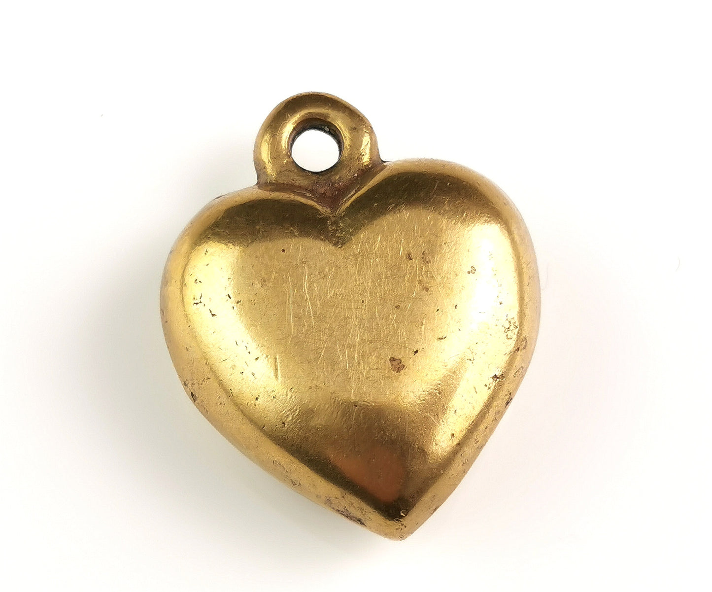 Antique Victorian brass puffy heart pendant