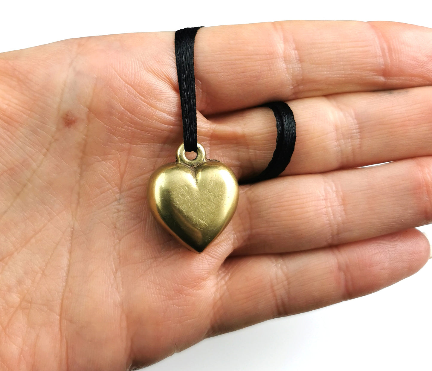 Antique Victorian brass puffy heart pendant