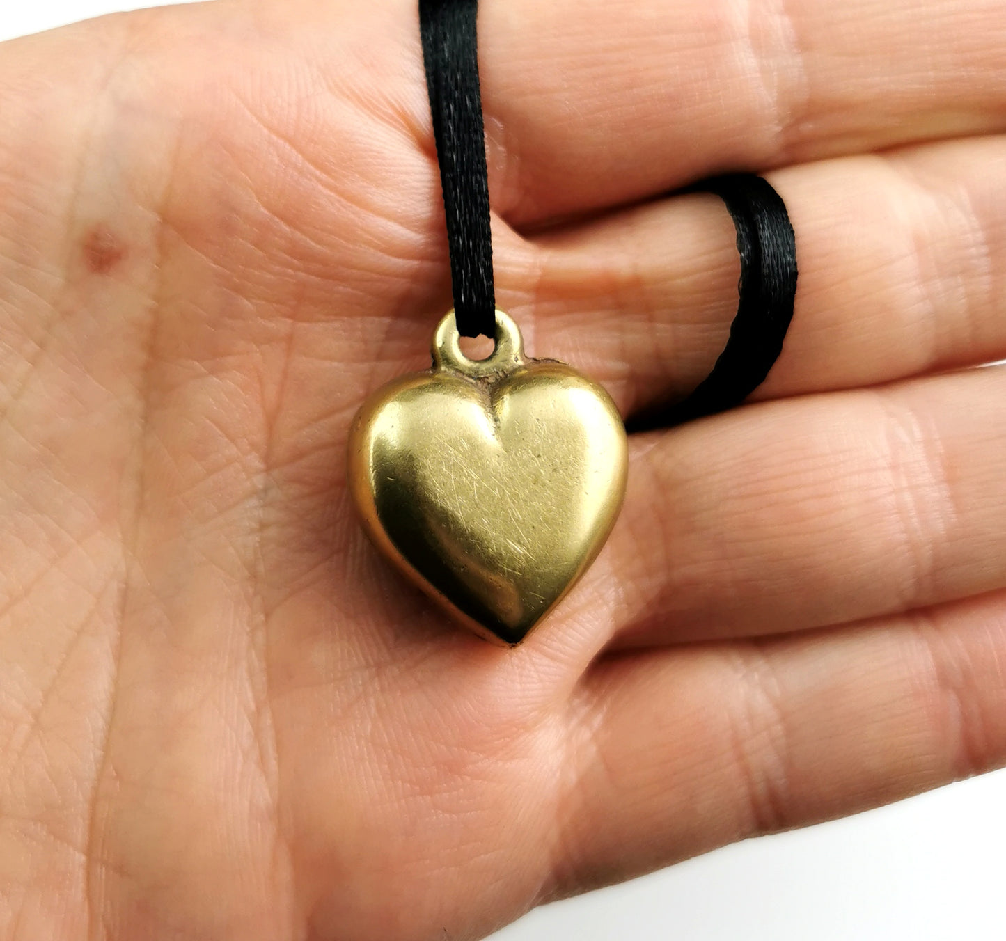Antique Victorian brass puffy heart pendant