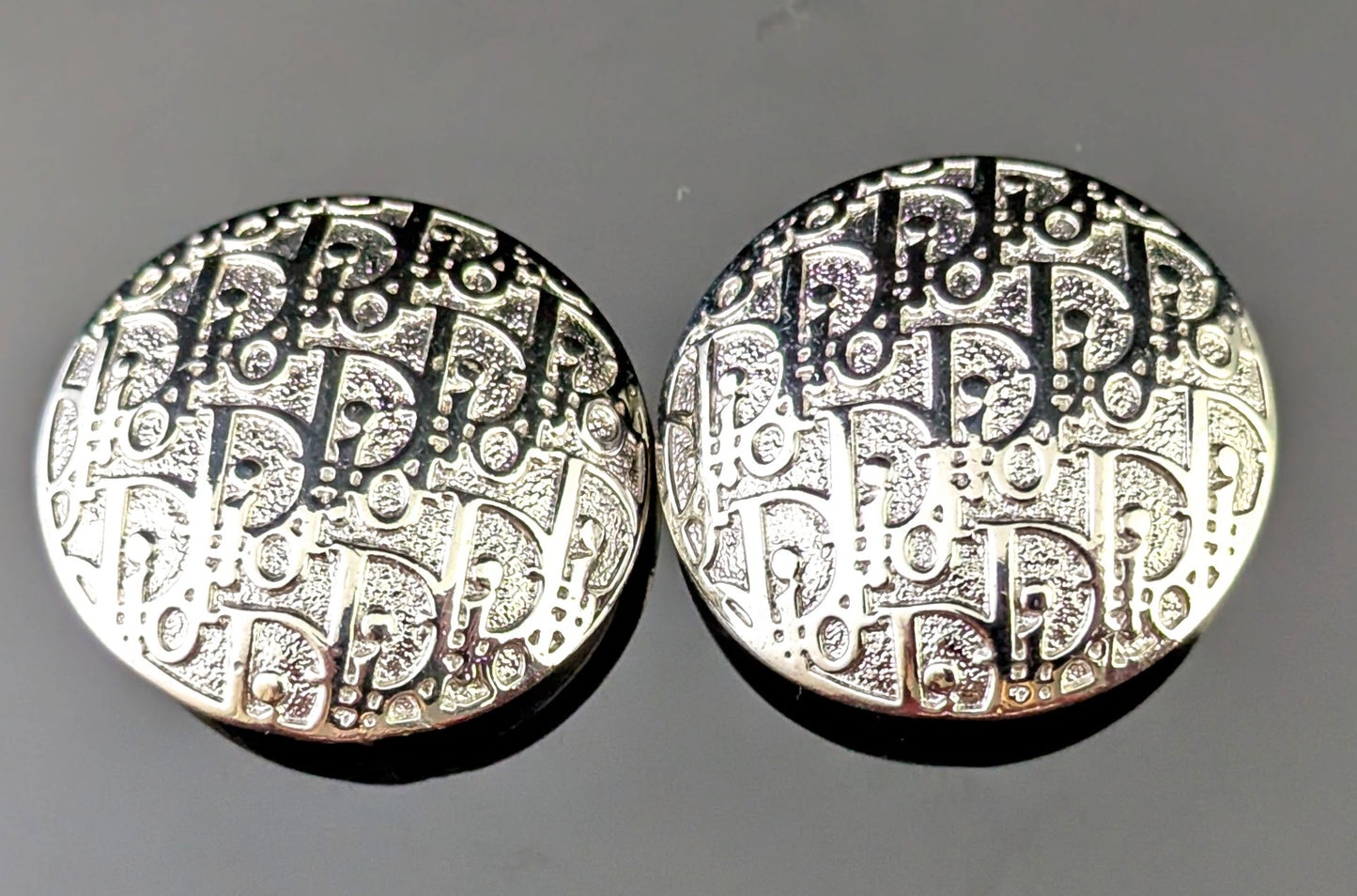 Vintage Christian Dior clip on earrings, logo script, silver tone