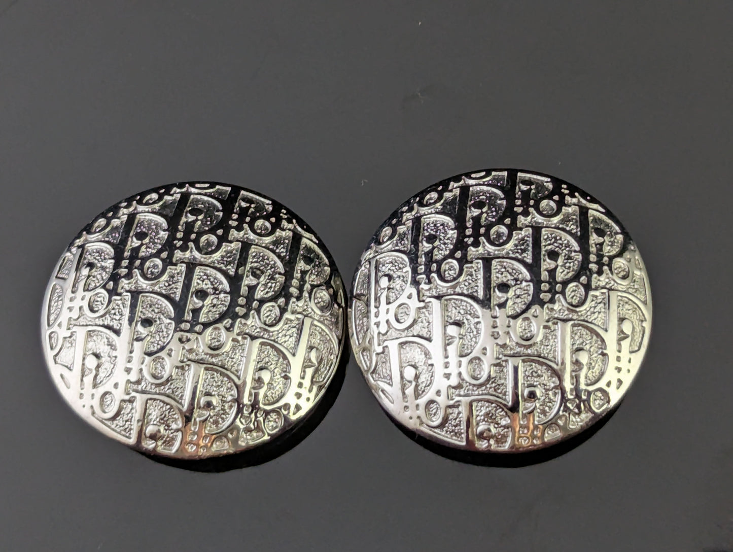 Vintage Christian Dior clip on earrings, logo script, silver tone