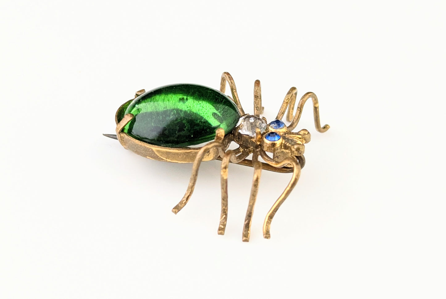 Antique emerald green paste spider brooch