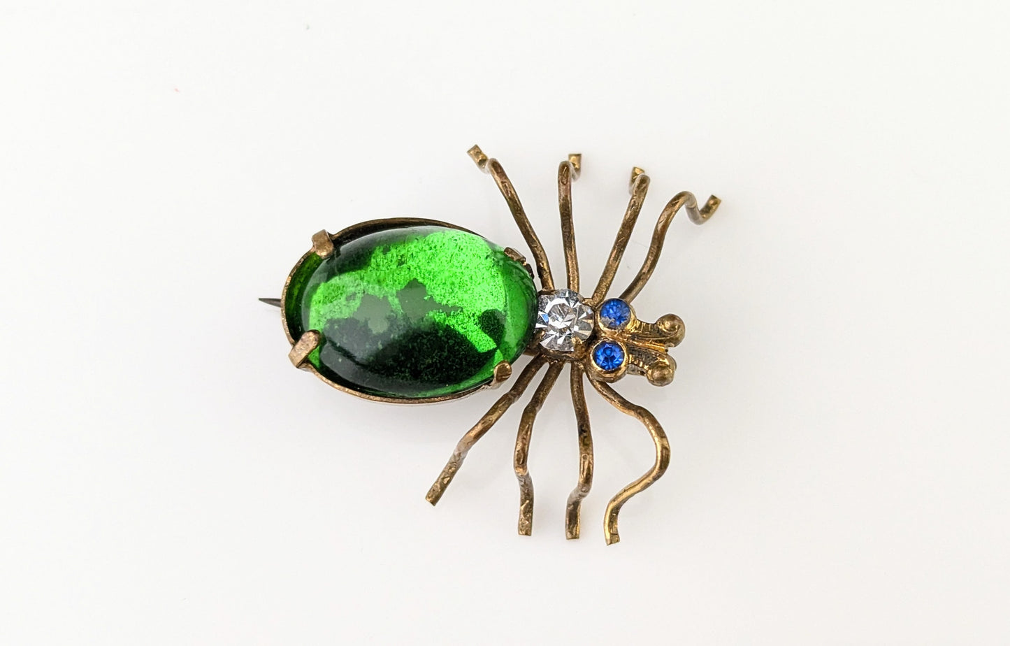 Antique emerald green paste spider brooch