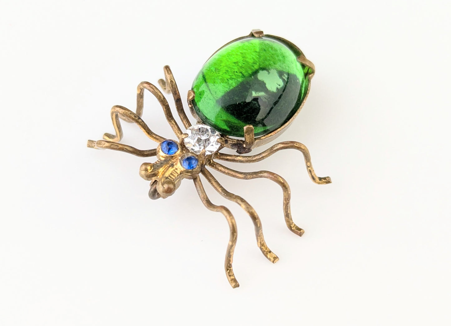 Antique emerald green paste spider brooch