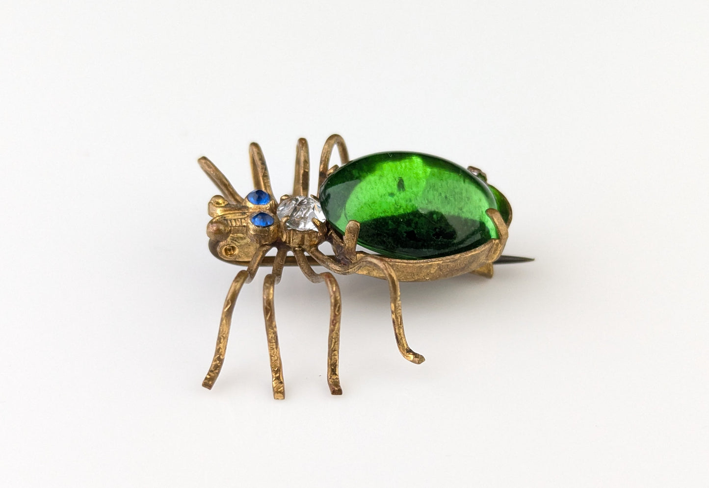 Antique emerald green paste spider brooch