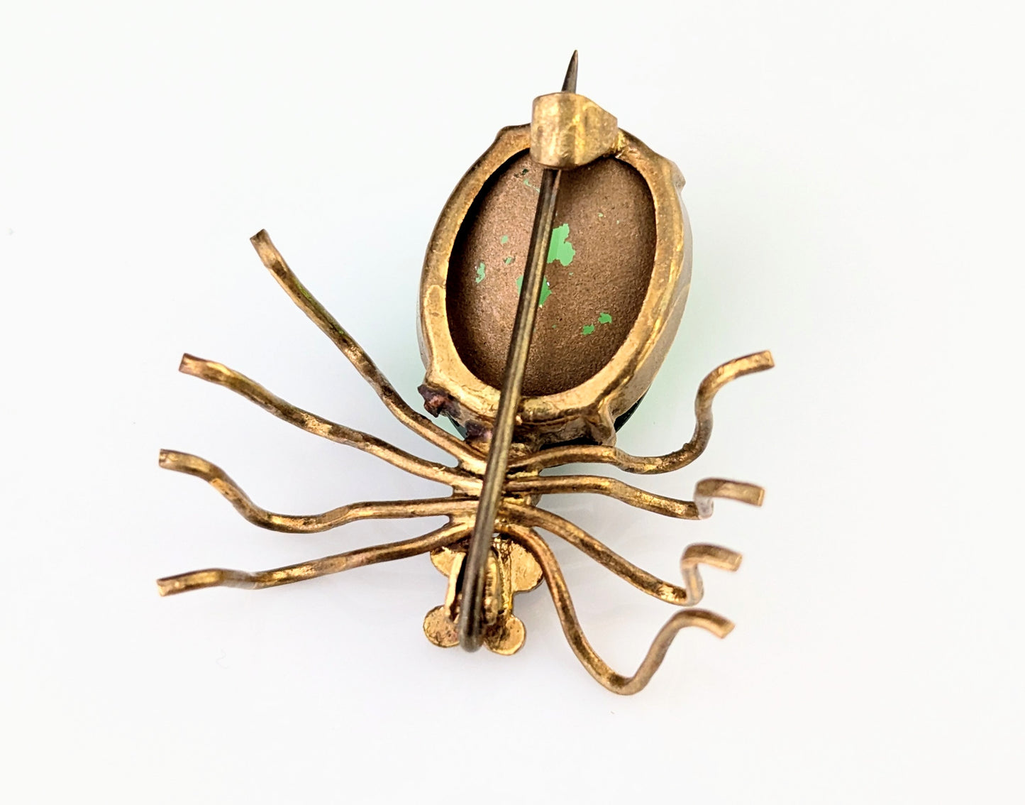 Antique emerald green paste spider brooch