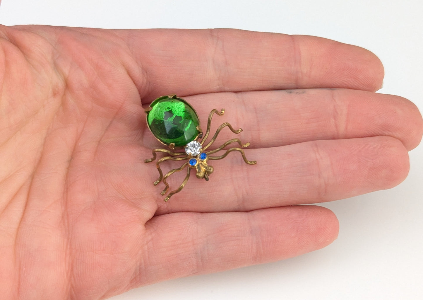 Antique emerald green paste spider brooch