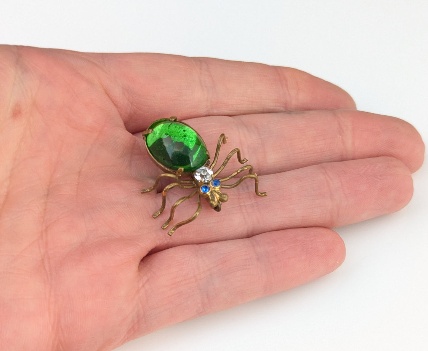 Antique emerald green paste spider brooch