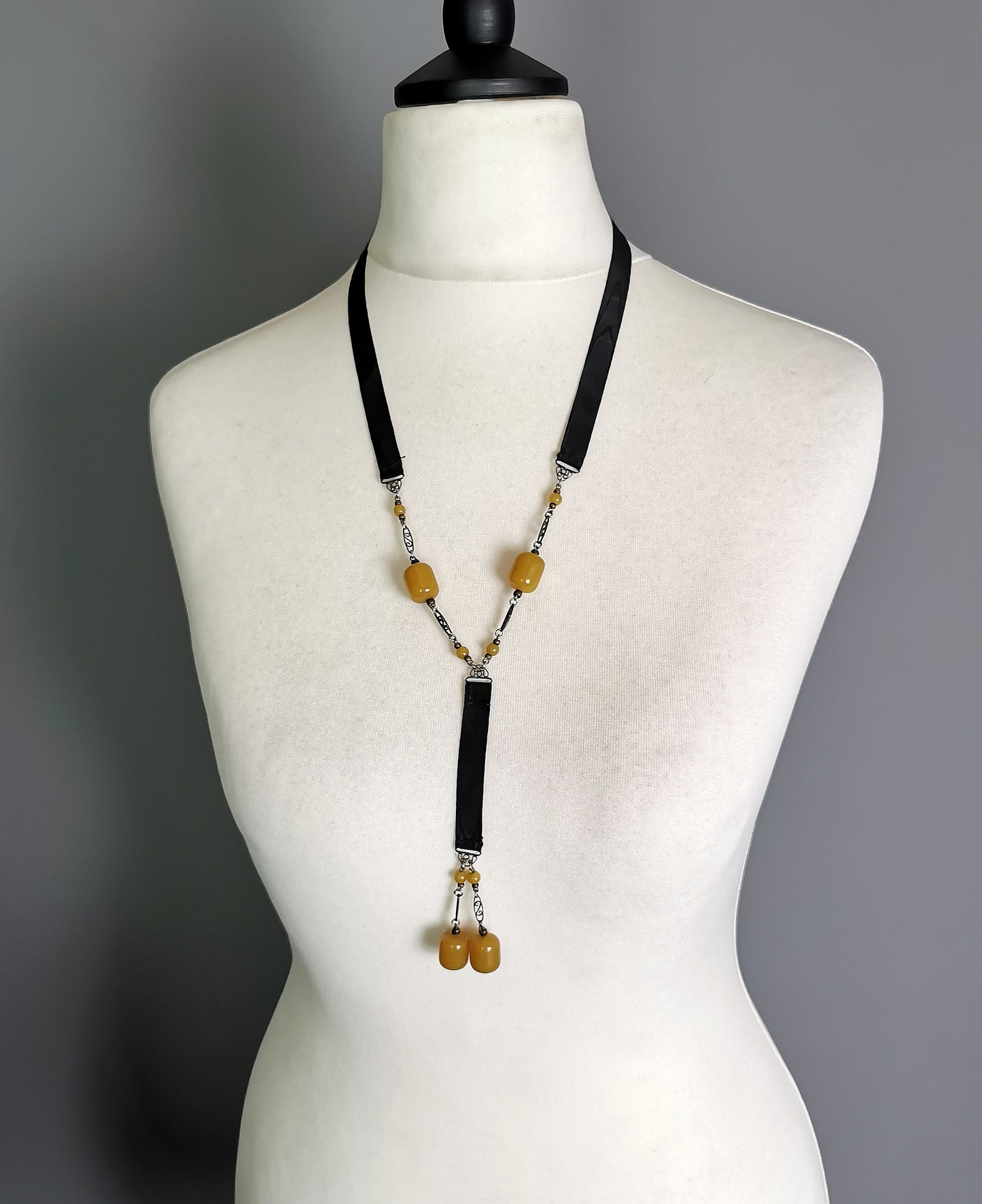 Antique Art Deco Sautoir necklace, black silk and butterscotch bead